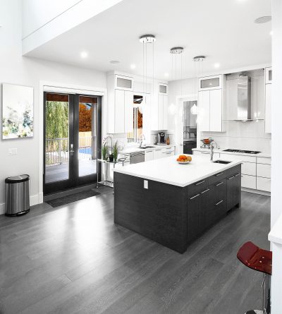 Notice the use of dark horizontal wood grain on the island that creates a great contrast within the room.  I really enjoy the simplicity of this kitchen and the way the architect maintains the lines.