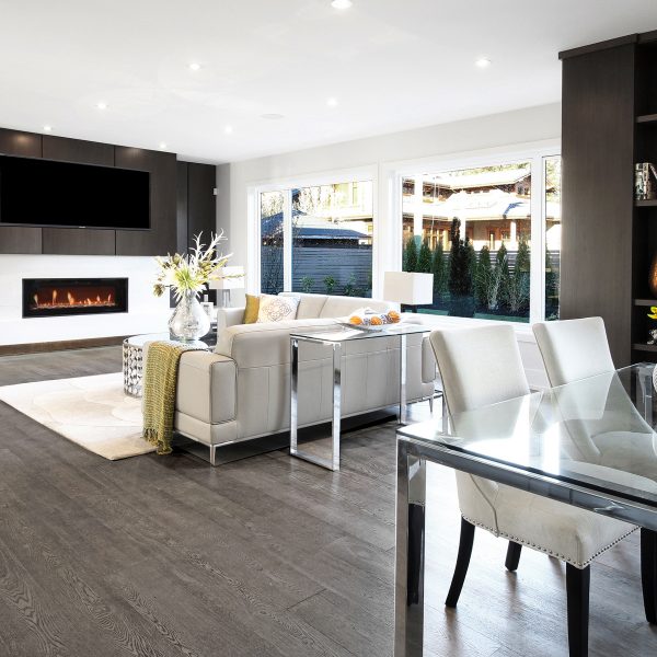 The use of re-claimed wood for the flooring is a wonderful treat.  Most of the cabinetry is this wonderfully rich dark chocolate that is combined with a bright white that lends it that contemporary look that is so popular.